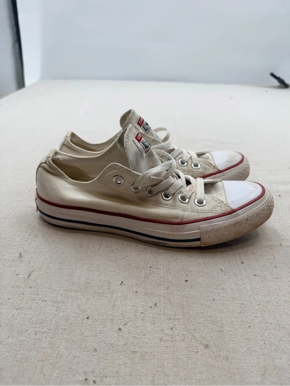 Converse White Low Top Sneakers with Red Trim